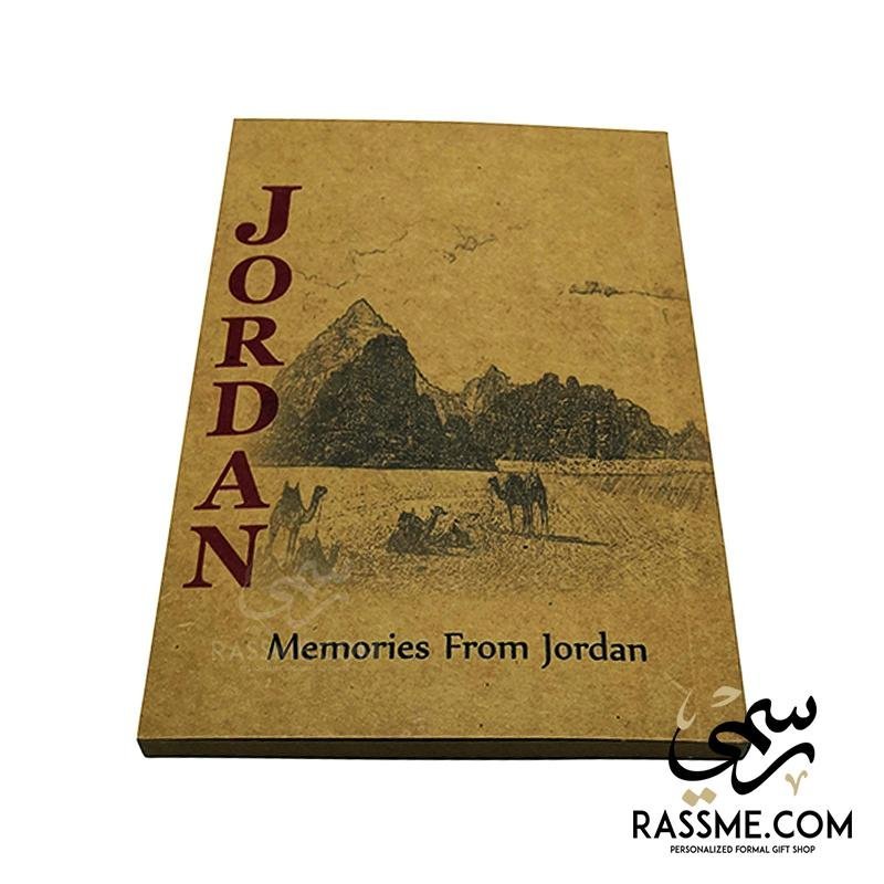 Small brown Jordan notebook with a desert illustration on the cover.