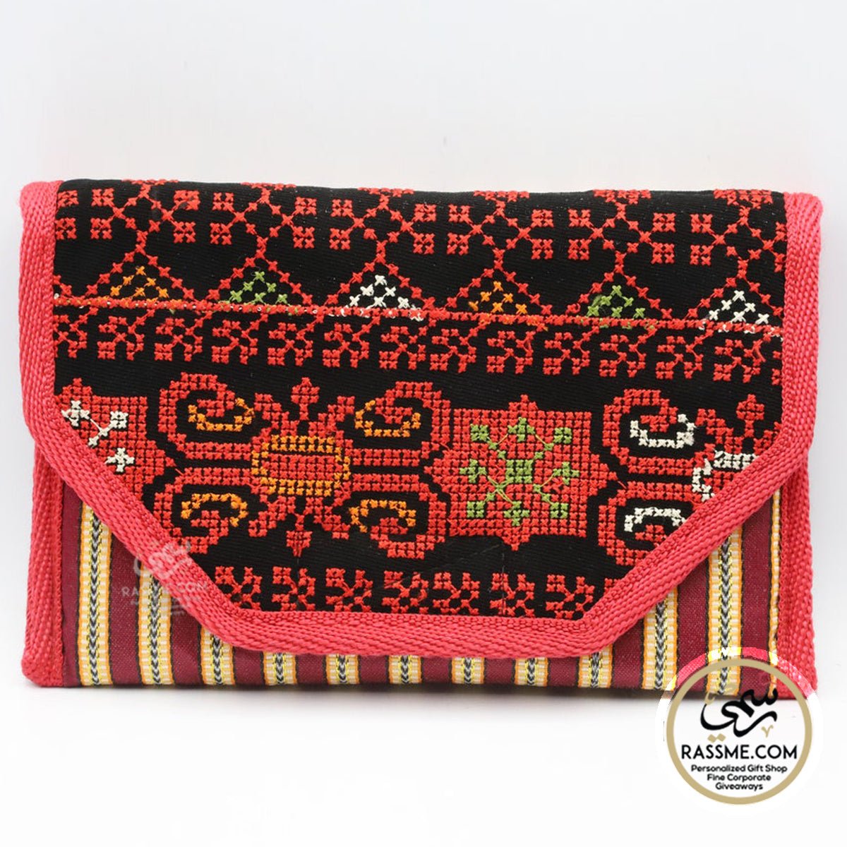 Red-and-black Palestinian embroidered wallet with a patterned flap.