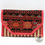 Red-and-black Palestinian embroidered wallet with a patterned flap.